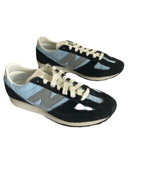 Women’s New Balance Black and Light Blue Suede Accent Sneakers